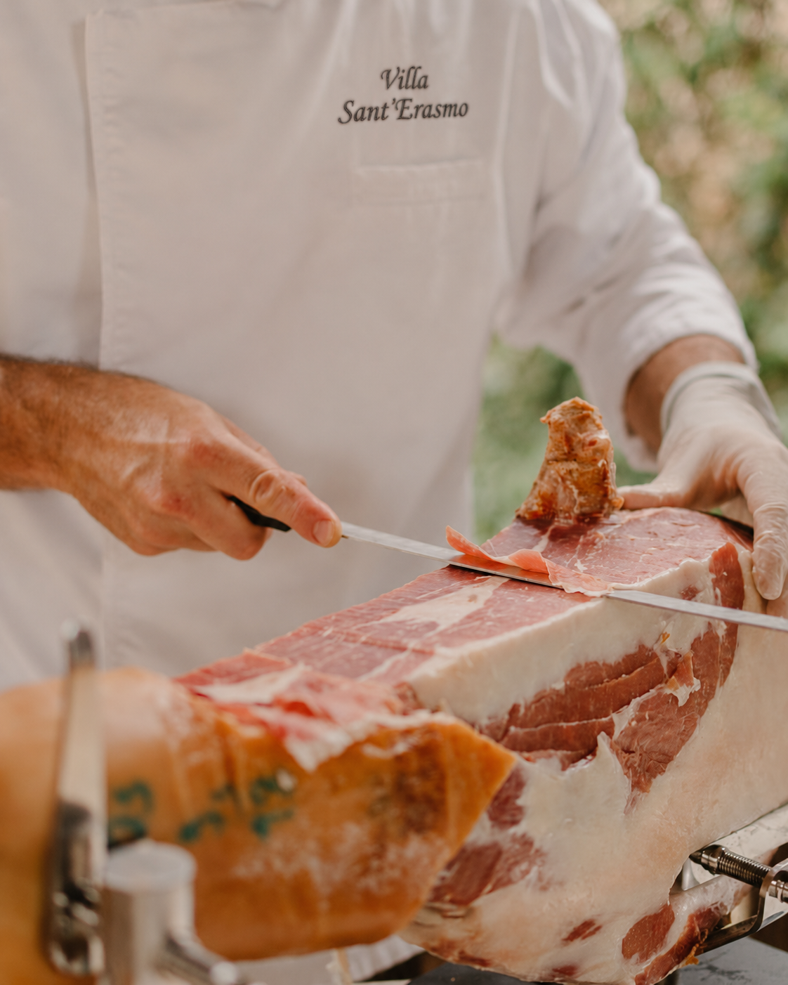 Villa Sant'Erasmo chef carving cured ham at the buffet