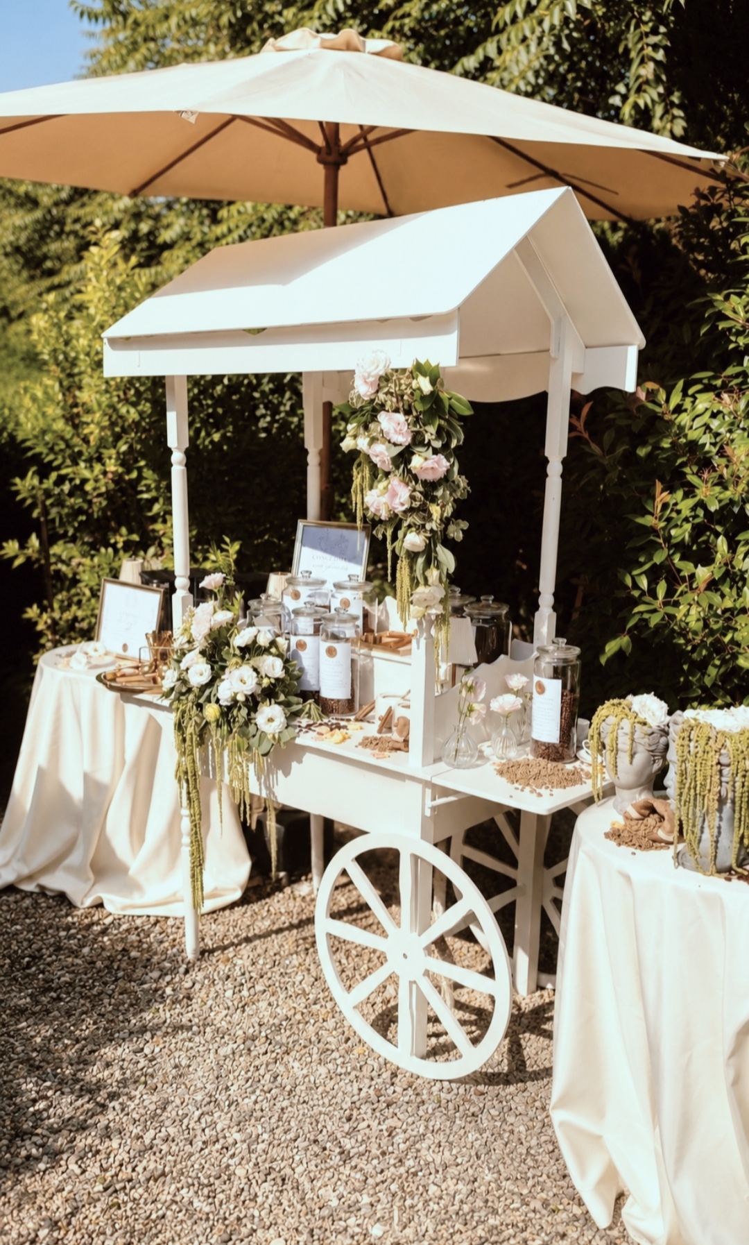 White cart of the coffee corner set up in the garden
