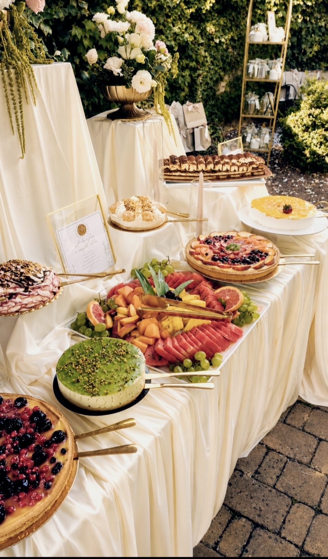 Buffet with fresh fruit, tarts and sweets