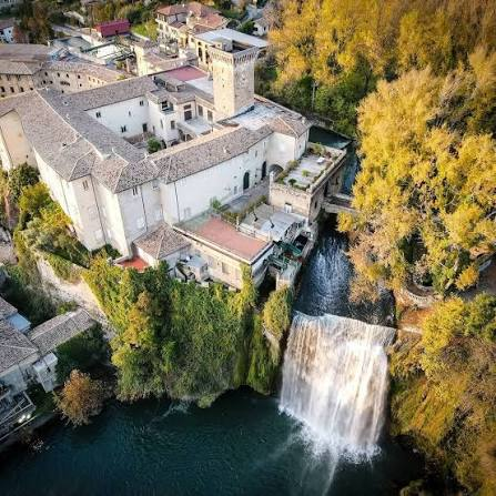 The Cascata Grande of Isola del Liri with Boncompagni-Viscogliosi Castle on the rock and golden autumn foliage