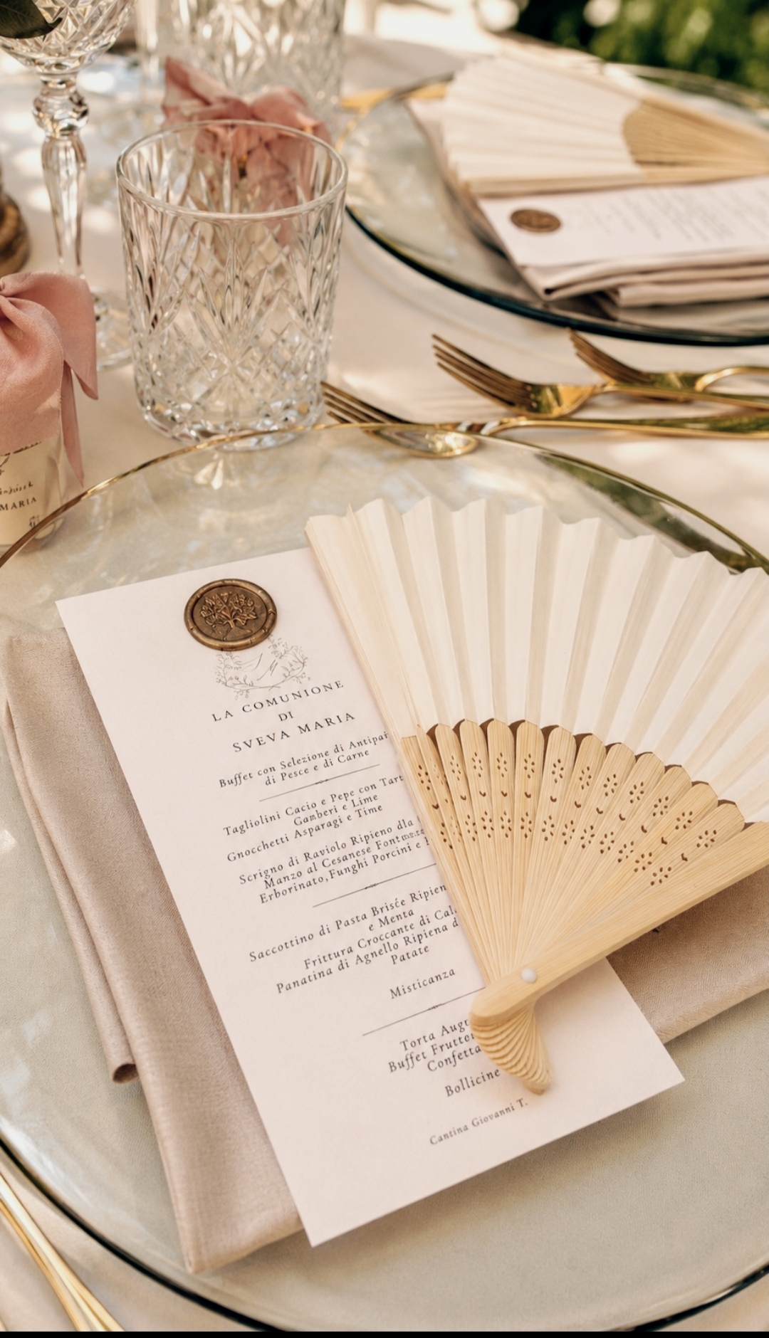 Communion menu with wax seal and fan on the table