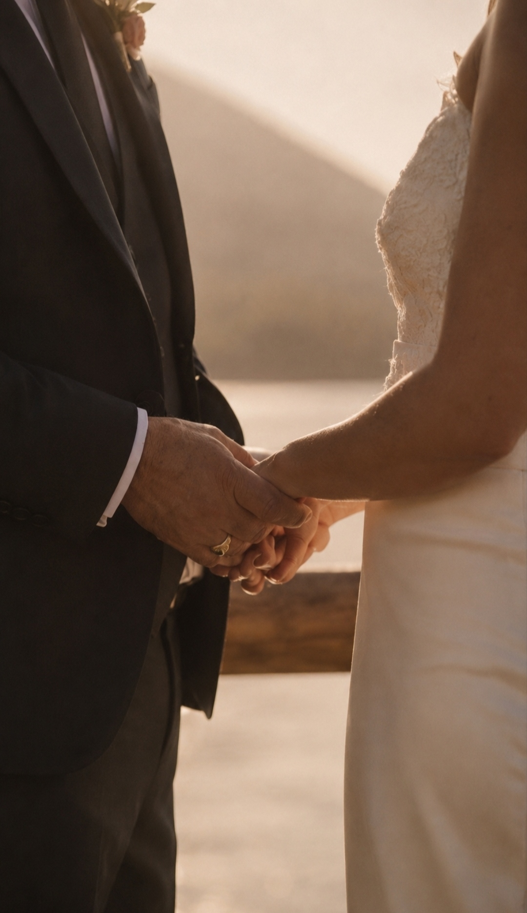 The couple's hands intertwined during the reception