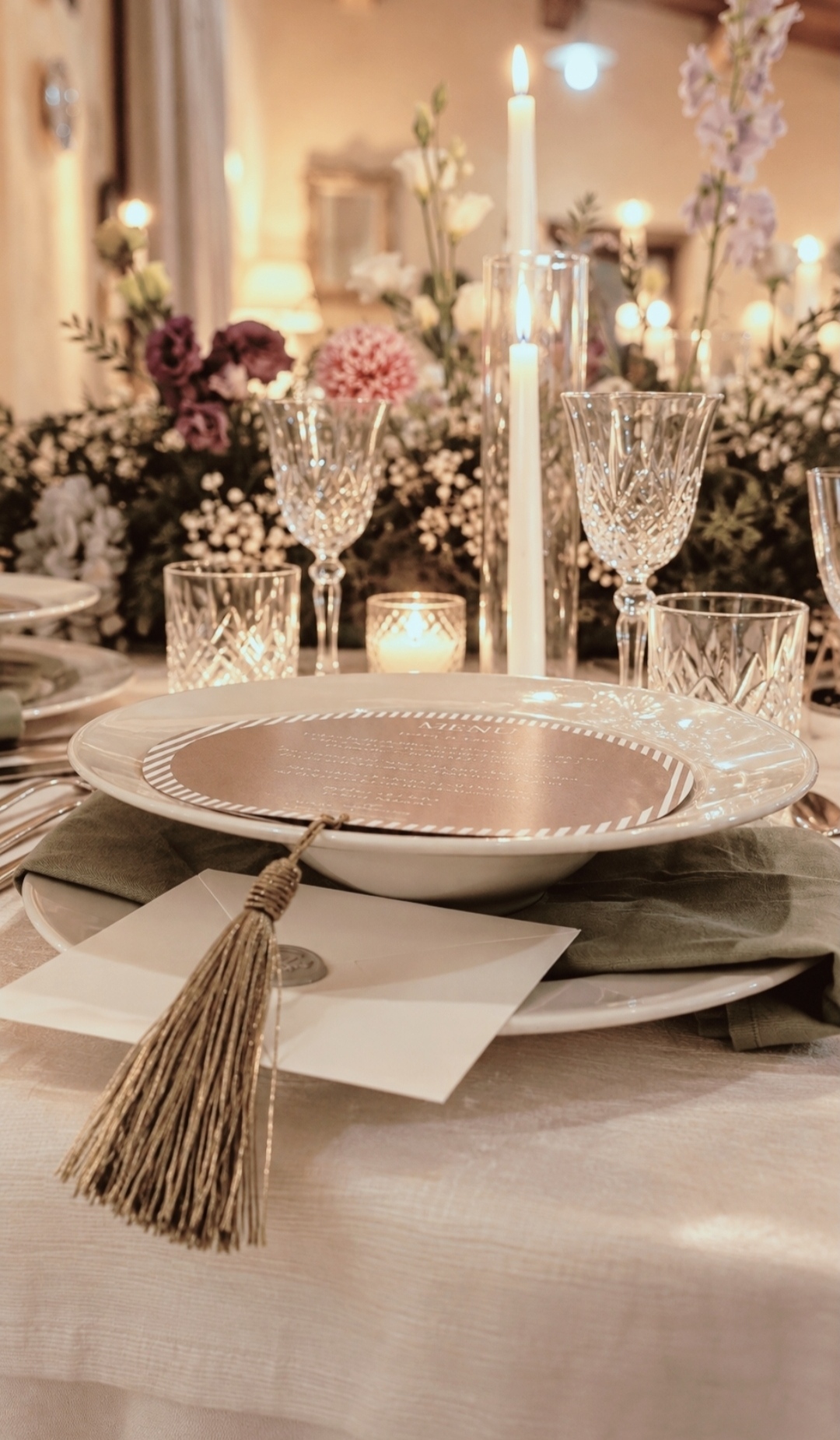 Table set in the rooms of the Villa with candles, crystal and flowers