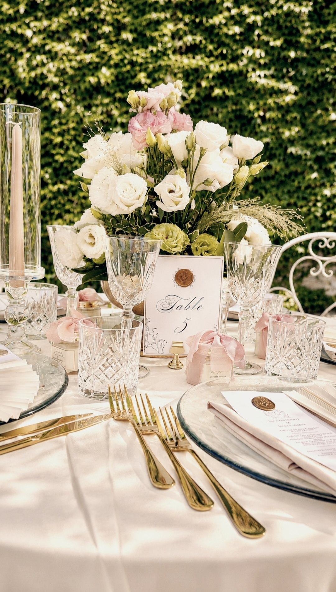 Communion table set with crystal, flowers and gilded cutlery